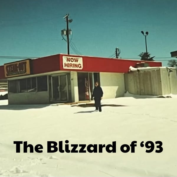 A person stands in deep snow outside a Steak-Out restaurant with a "Now Hiring" sign.